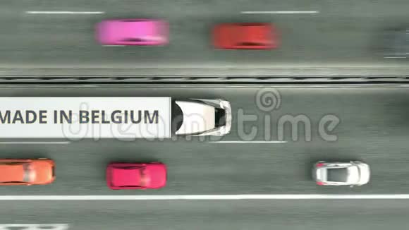 拖车卡车与MADE在BELGIUM文字沿公路行驶比利时商业相关的可循环三维动画视频的预览图