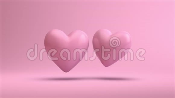 粉红色的心在干净的粉红色背景上漂浮在空气中视频的预览图