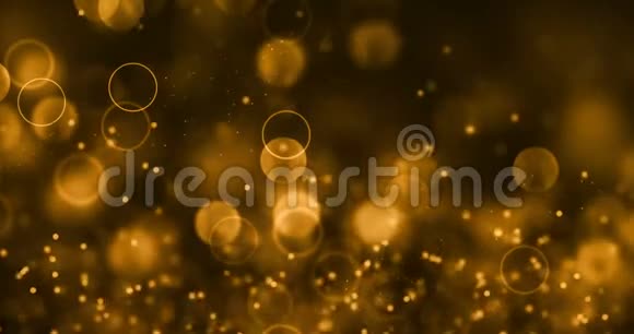 圣诞节黄金渐变闪耀的闪光尘埃粒子从顶部黑色背景与波克流动的运动黄金假日视频的预览图