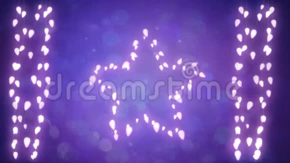 在紫色背景上闪烁的星星和一串仙女的灯光视频的预览图