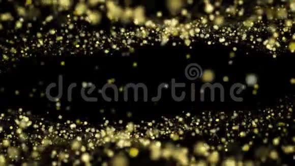 美丽的金色粒子在黑色背景上缓慢流动视频的预览图
