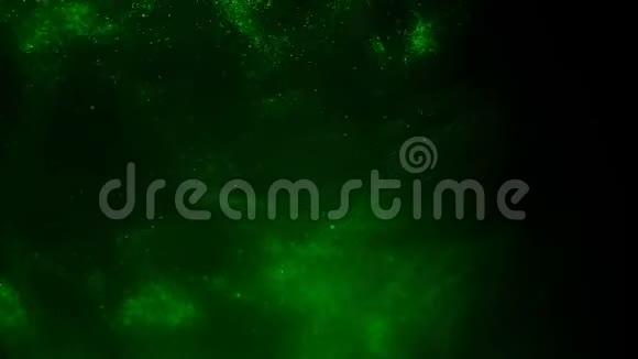 黑色背景上绿色粒子的爆炸视频的预览图