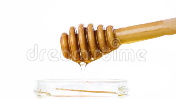 打开蜂蜜罐上面有木制蜂蜜的细节视频的预览图