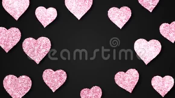 粉红色闪亮的心在黑色的背景上闪闪发光情人节节日抽象循环动画视频的预览图