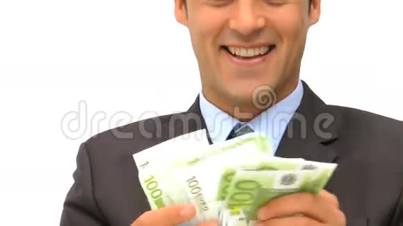 快乐的商人亲吻他的钱视频的预览图