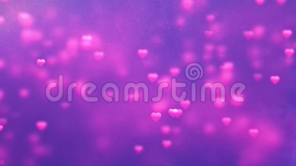 上下移动的心浪漫的旋转发光的爱的心彩色的粒子泡沫慢慢移动上升的肥皂泡漂浮在视频的预览图
