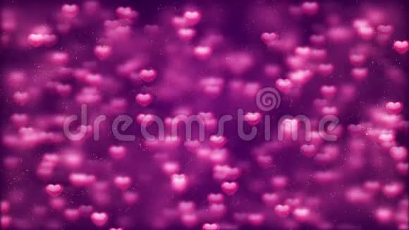 浪漫的旋转荡漾闪耀的爱情红心塑造粉色粒子飞动循环紫色背景情人节莫特视频的预览图