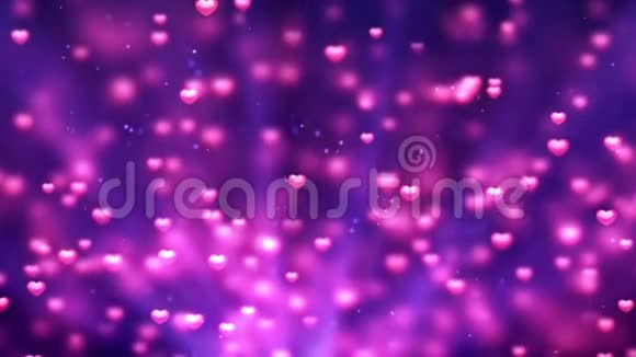 浪漫的旋转荡漾闪耀的爱情红心塑造粉色粒子飞动循环紫色背景情人节莫特视频的预览图