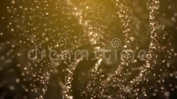 旋转圈从闪烁和发光的金色粒子视频的预览图