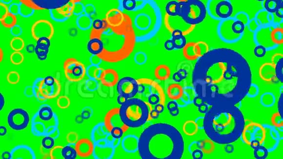 飞舞着五彩的圆圈粒子在绿色的屏幕上放大视频的预览图