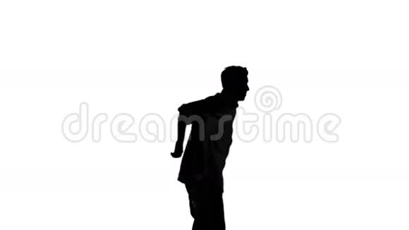 一个男人在白色背景上跳跃和举起手臂的剪影视频的预览图