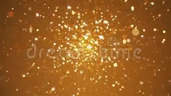 闪闪发光的金色火花在模糊的背景中飞舞视频的预览图