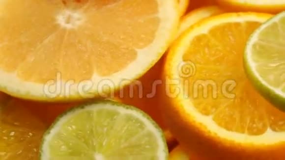新鲜的柑橘类水果旋转视频镜头的概念健康饮食旋转切片橙子石灰柠檬葡萄视频的预览图