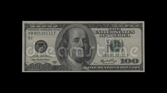 一百美元钞票变成一叠叠一叠的钞票旋转着视频的预览图