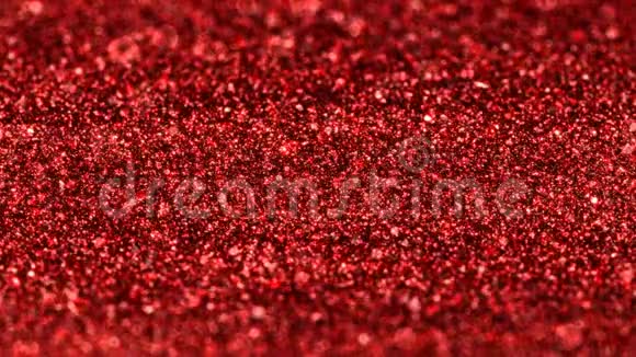 闪亮的红色微光粒子圣诞无缝环抽象背景视频的预览图