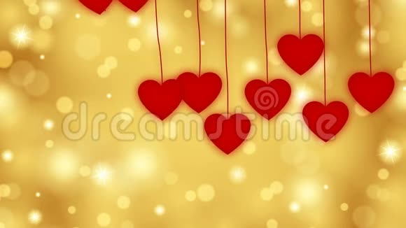 红色的心从上面落在金色的背景上视频的预览图