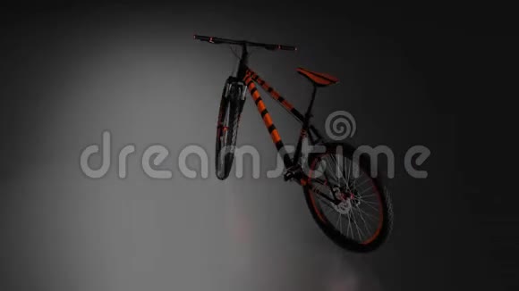 无限旋转与黑色背景围绕黑色和橙色山自行车视频的预览图
