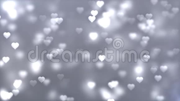 白色灰色的心浪漫的旋转发光的爱心彩色粒子视频的预览图