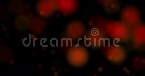 抽象的圣诞色彩缤纷的粒子在黑色的背景上流动节日的圣诞喜庆视频的预览图