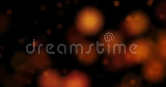 抽象的圣诞色彩缤纷的粒子在黑色的背景上流动节日的圣诞喜庆视频的预览图