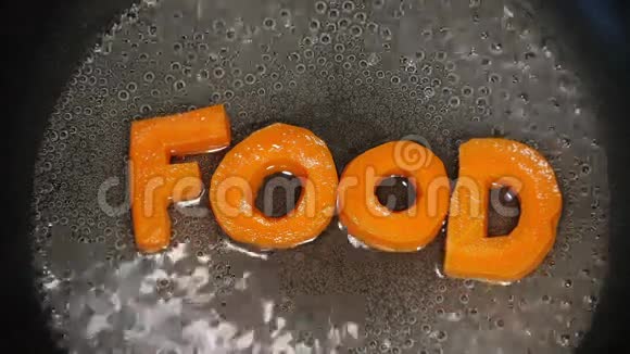 单词食物是由胡萝卜雕刻而成的字母视频的预览图