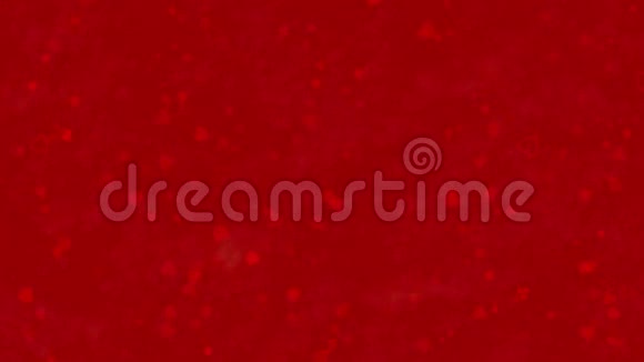情人节快乐的文字是由灰尘形成的在红色的背景变成了横向的灰尘视频的预览图