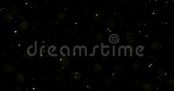 金色恒星粒子有星光闪闪或闪光的光效应在黑色背景光芒闪耀金色光芒视频的预览图