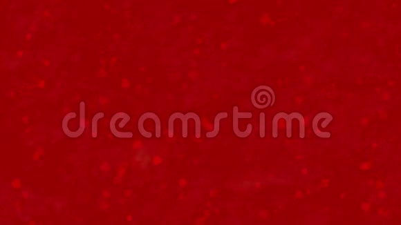 情人节快乐的瑞典文GallaHjartansDag是由灰尘形成的在红色背景下变成水平的灰尘视频的预览图