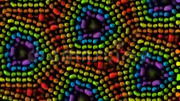 彩色豌豆建筑旋转几何万花筒图案黑色背景无缝抽象视频视频的预览图
