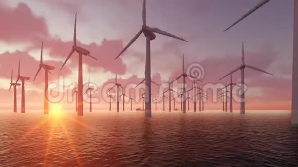 日落时分风力发电机在海洋中形成轮廓视频的预览图