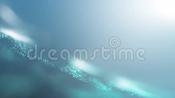 蓝色闪闪发光的粒子像海浪一样流动抽象循环4k动画背景视频的预览图