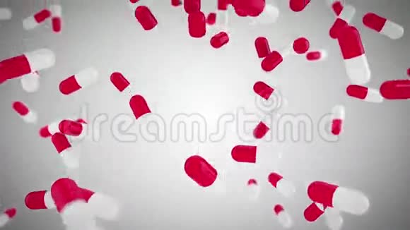 粉红色和白色的药丸掉落视频的预览图