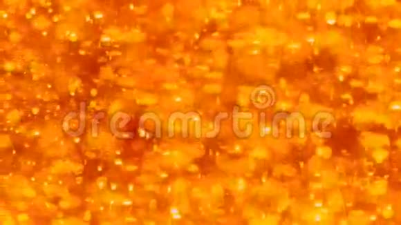 橙色背景与移动粒子视频的预览图