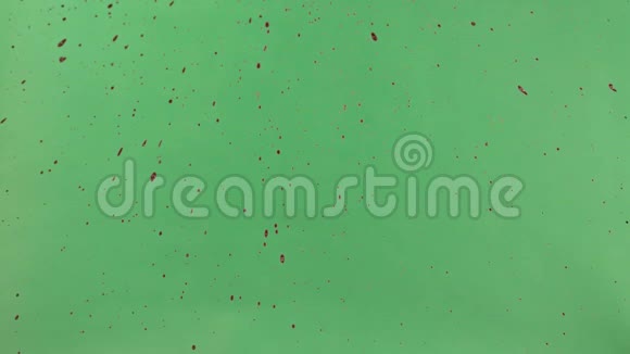 红墨水洒过绿色屏幕背景视频的预览图