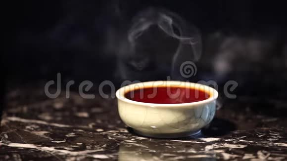 黑热中式茶杯大理石背景视频的预览图