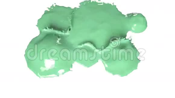 彩色颜料绿色的水滴落下来溅在白色上视频的预览图