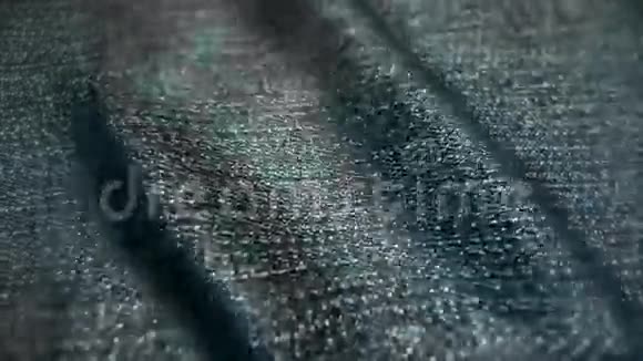 现实的牛仔裤在风中飘扬抽象背景超高清分辨率特写面料质感无缝环路视频的预览图