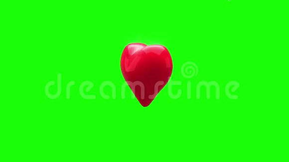 红色的心在绿色的背景上旋转和爆炸视频的预览图