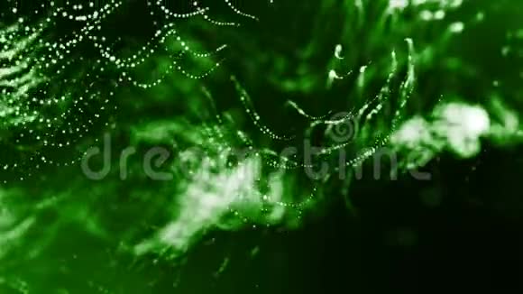 动态抽象背景的发光粒子与闪亮的波克火花暗绿色成分振荡视频的预览图
