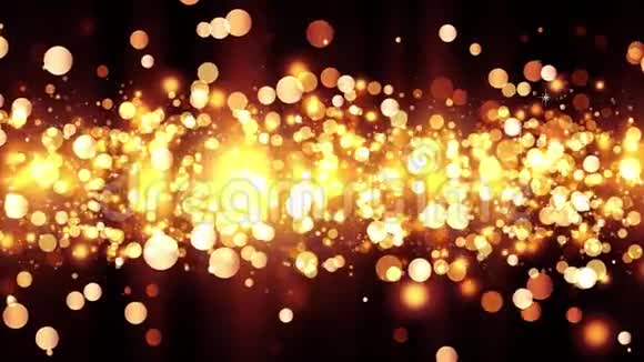 背景有闪亮的金色粒子漂亮的bokeh光背景金色的五彩纸屑与神奇的闪光视频的预览图