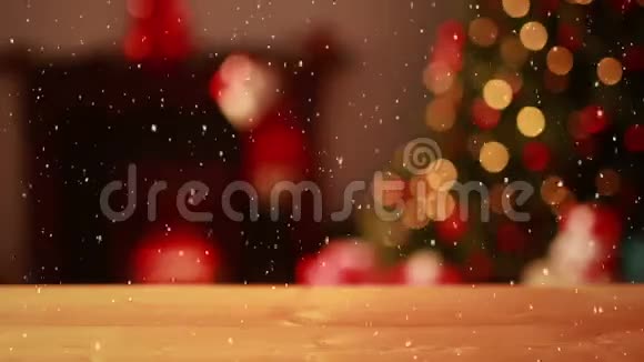 视频合成与雪花覆盖模糊的视频圣诞树灯和书桌前视频的预览图