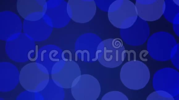蓝色摘要背景蓝色背景上明亮的闪光圆圈视频的预览图