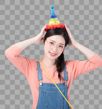 戴着生日帽微笑庆祝的青年女性图片图片素材免费下载