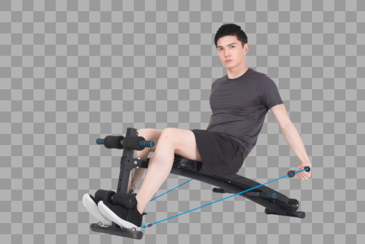 坐在运动器械上拉阻力带的健身男性图片素材免费下载