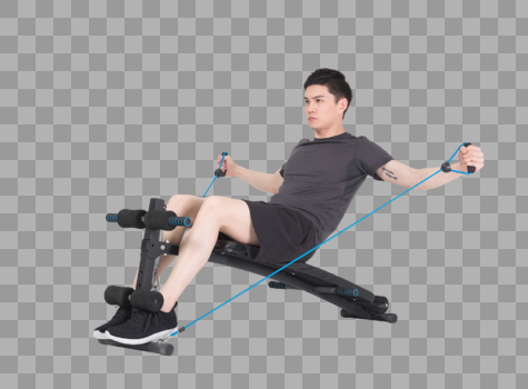 坐在运动器械上拉阻力带的健身男性图片素材免费下载