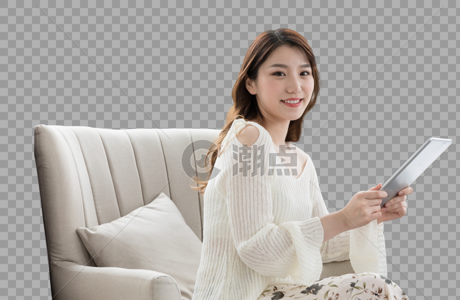 年轻女性在卧室放松看平板电脑图片素材免费下载