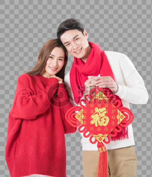 年轻夫妻拿着新年中国结图片素材免费下载