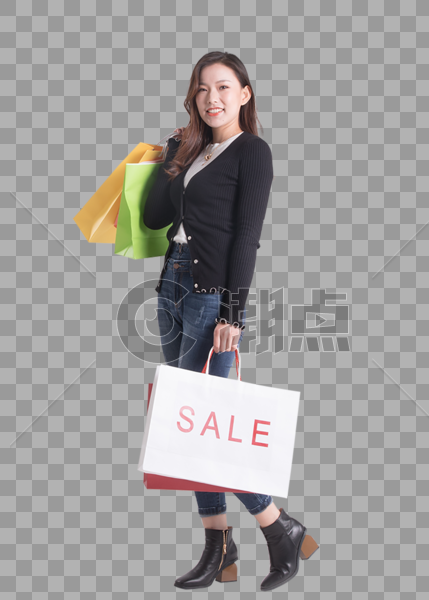 年轻女性提着购物袋走路图片素材免费下载