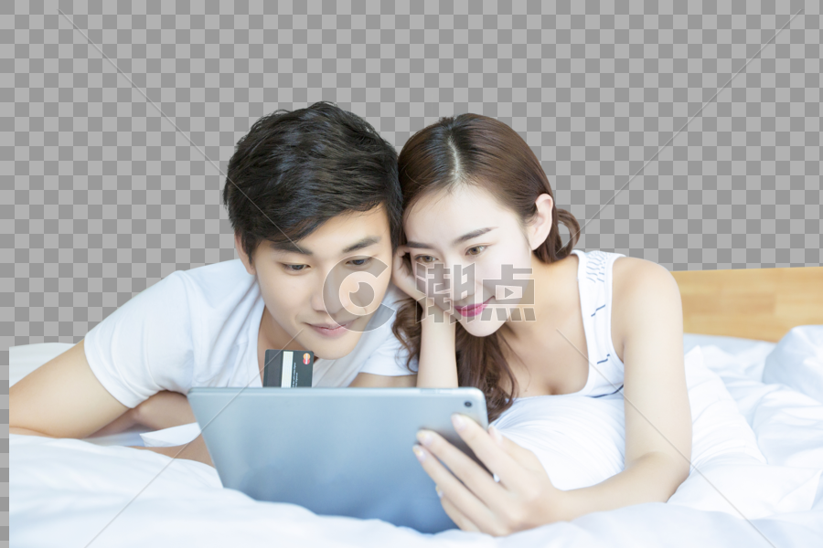 年轻情侣在床上网购图片素材免费下载