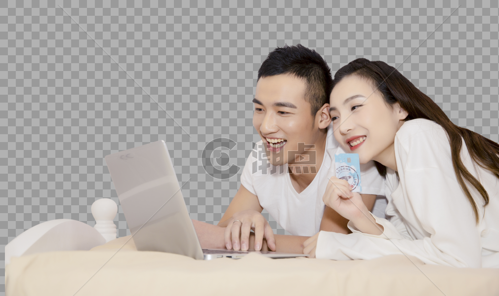 年轻夫妇在卧室用电脑购图片素材免费下载